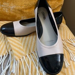 Cream and black flats